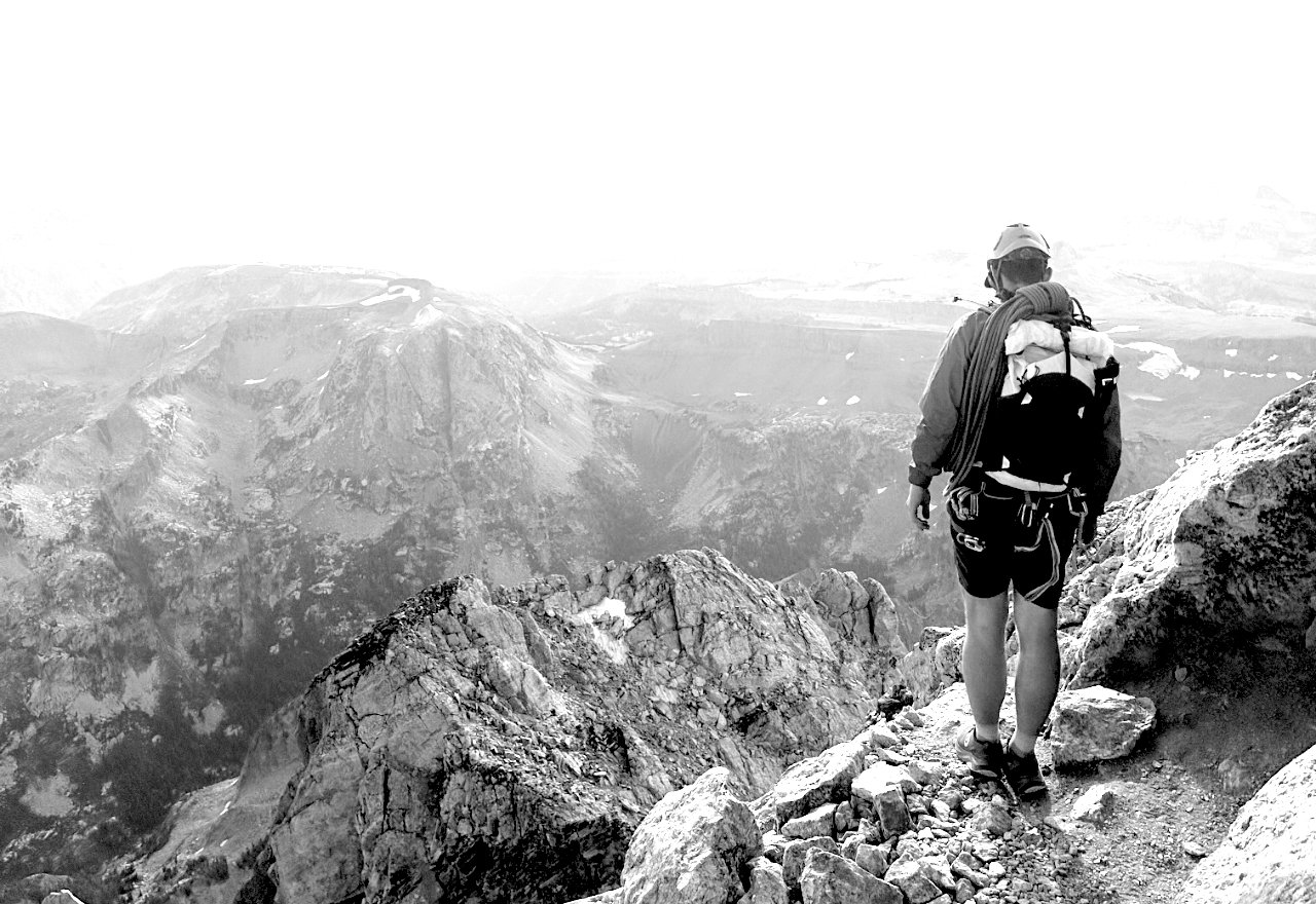 Photo of a person on a mountain wearing the Altruist race vest.