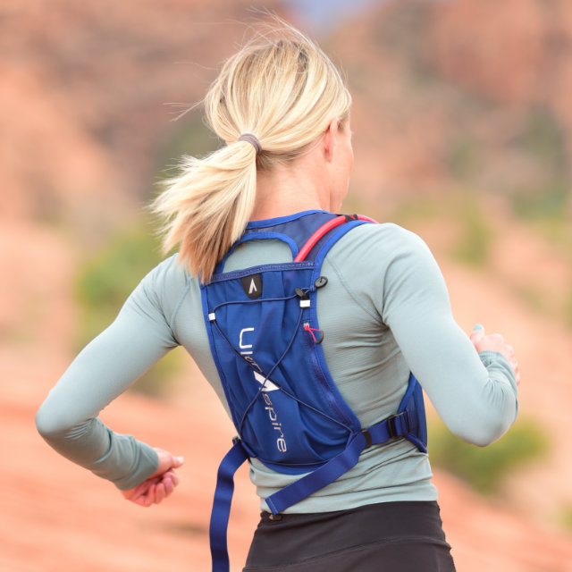 A runner wearing a Spry 5.0 Race Vest