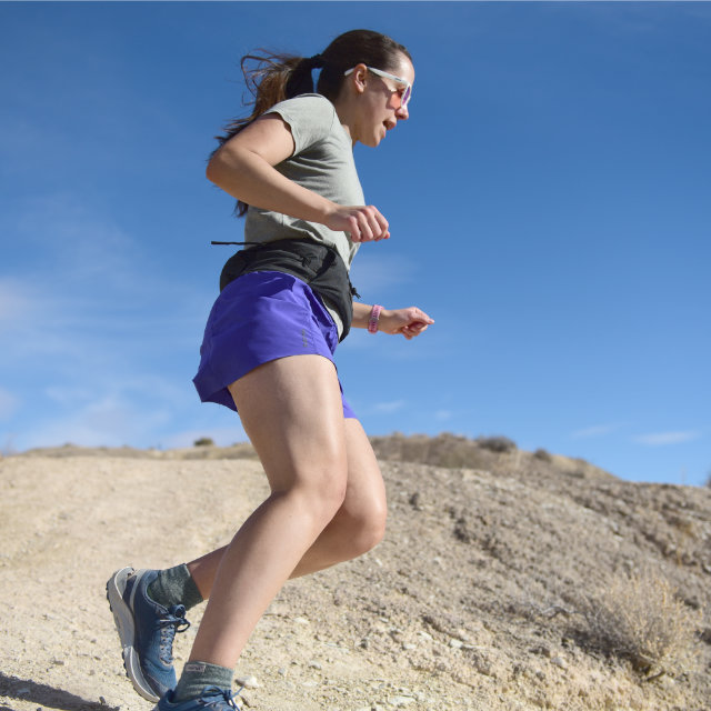 An athlete running down an incline.